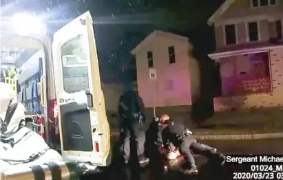  ?? ROCHESTER POLICE VIA ROTH AND ROTH LLP VIA AP ?? In images taken from police body camera videos, Rochester, N.Y., police officers hold down Daniel Prude on March 23.