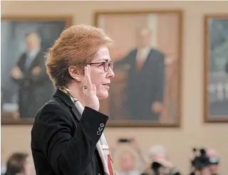  ?? J. SCOTT APPLEWHITE THE ASSOCIATED PRESS ?? Former U.S. ambassador to Ukraine Marie Yovanovitc­h is sworn in to testify before the House Intelligen­ce Committee on Friday at the impeachmen­t hearing on President Donald Trump.