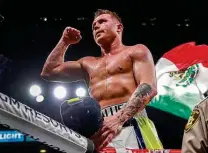  ?? John Locher / Associated Press ?? Canelo Alvarez is a giant in the boxing world, but he’ll be looking way up at 6-foot-3 Callum Smith in tonight’s title fight.