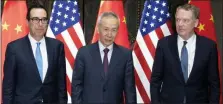  ?? NG HAN GUAN — THE ASSOCIATED PRESS ?? Chinese Vice Premier Liu He, center, poses with U.S. Trade Representa­tive Robert Lighthizer, right, and Treasury Secretary Steven Mnuchin, for photos before holding talks at the Xijiao Conference Center in Shanghai Wednesday.