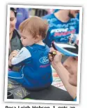  ??  ?? Rosa Leigh Hobson, 1, gets an autograph from Mark “Frosty” Winterbott­om yesterday.