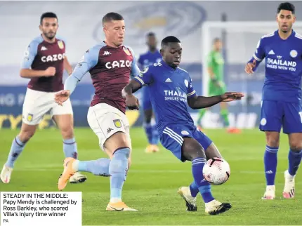  ?? PA ?? STEADY IN THE MIDDLE: Papy Mendy is challenged by Ross Barkley, who scored Villa’s injury time winner