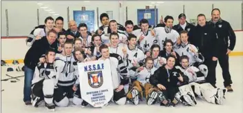  ?? - Submitted ?? The NKEC Titans pose with the provincial championsh­ip banner after winning the fifth D-2 boys’ hockey championsh­ip in the school’s 14-year history March 27 on the Eastern Shore. NKEC has been provincial runner-up on three other occasions.