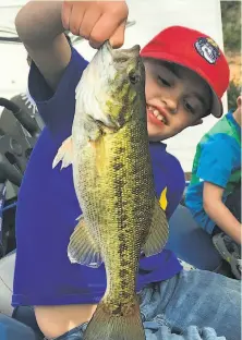  ?? Heather Solus / Special to The Chronicle ?? Oliver Solus, 7, didn’t play video games over spring break, he went fishing at Shasta with his parents and caught this bass.