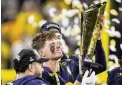  ?? ERIC GAY / AP ?? Michigan quarterbac­k J.J. Mccarthy celebrates after their win against Washington in the national championsh­ip on Jan. 8.