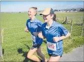  ??  ?? Ella Malcolm and Emma Dudley on the run together.