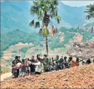  ??  ?? Hani people celebrate the Kai Yang Men festival with dances and music in the Honghe Hani and Yi autonomous prefecture in Yunnan province. Young women clad in traditiona­l attire compete in a beauty contest. Local people enjoy a variety of delicacies....