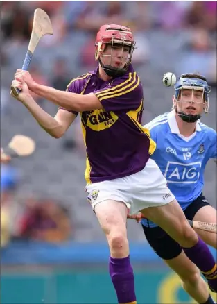  ??  ?? Wexford forward Connal Flood comes under pressure from Dublin’s David Keogh.