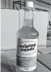  ??  ?? Glenora Distillery started producing Helping Hands hand sanitizer about two months ago as shortages of that product became noticeable.