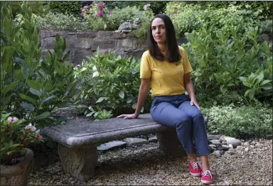  ?? (AP/Jacquelyn Martin) ?? Juliana Macedo do Nascimento, a Deferred Action for Childhood Arrivals program recipient who moved to the U.S. from Brazil when she was 14, sits on a bench Friday outside her apartment in Washington.