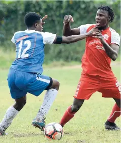  ?? FILE ?? Reno’s Chevar Menzie and then Maverley-Hughenden player Rodico Wellington (right) battle for the ball during their Red Stripe Premier League match at Barbican on Sunday, April 9. Wellington has now signed with Waterhouse.