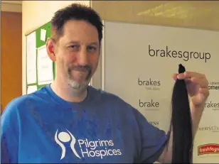  ??  ?? Daryn raised more than £1,000 for the Pilgrims Hospice in 2013 by cutting his long hair, which he had spent nine years growing