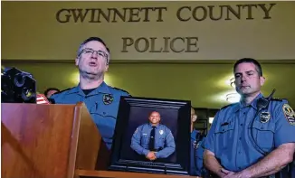  ?? HYOSUB SHIN / HSHIN@AJC.COM ?? Chief Butch Ayers speaks to members of the media outside Gwinnett County Police Department in Lawrencevi­lle on Saturday. Gwinnett County Police Officer Antwan Toney, who was shot and killed Saturday, was “an absolutely fantastic kid,” said his trainer, Sgt. Kris Llewellyn.