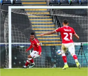  ?? PICTURE: Dan Istitene/getty Images ?? Former Bath City loanee Antoine Semenyo scores in to an open net after blocking a kick from Swansea City’s Freddie Woodman for Bristol City on Saturday