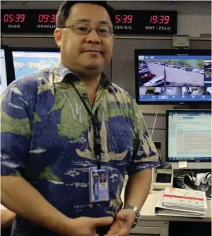  ?? (AP Photo/Jennifer Sinco Kelleher, File) ?? In this July 21, 2017 file photo, Jeffrey Wong, the Hawaii Emergency Management Agency’s operations officer, shows computer screens monitoring hazards at the agency’s headquarte­rs in Honolulu. The photo originally accompanie­d an Associated Press story...