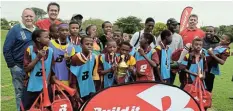  ?? Picture: TKMTIKI ?? CELEBRATIO­N: Dambuza Primary School football players were over the moon on Saturday after being crowned 2022 Build it Under 13 champions while Ikamva Lesizwe U15 were netball champions. With the winning team are, from left, Build it owner Andre Swanepoel, Bushman’s Build it manager Dylan Lottering and, right, Kowie Build it manager Jorie Jordaan.