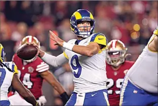  ?? TONY AVELAR / AP ?? Los Angeles Rams quarterbac­k Matthew Stafford (9) passes against the San Francisco 49ers during the first half of an NFL game in Santa Clara on Nov. 15.