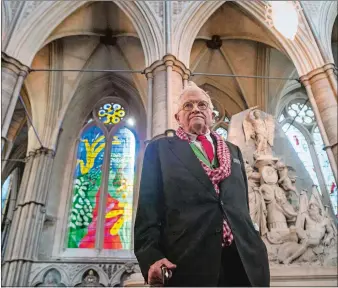  ?? VICTORIA JONES/POOL VIA AP ?? Artist David Hockney stands in front of The Queen’s Window, a new stained glass window at Westminste­r Abbey, London, that he designed.