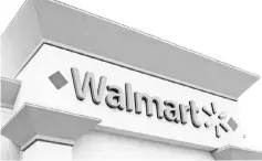  ?? — Reuters photo ?? AWalmart store is seen in Encinitas,California.Walmart updated investors on its latest new gadgets and time-saving pickup options to lure shoppers to stores and away from arch-rival Amazon.