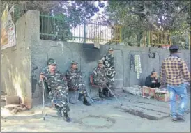  ?? HT PHOTO ?? Several police and BSF men continued to be deployed in Raghubir Nagar on Sunday to thwart any attempt to ignite communal tensions.