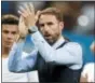  ?? REBECCA BLACKWELL — THE ASSOCIATED PRESS ?? England head coach Gareth Southgate applauds as he walks off the field at the end of a 2-1 semifinal loss to Croatia on Wednesday.
