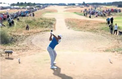  ?? RICHARD HEATHCOTE/R&A/GETTY IMAGES ?? Tiger Woods only had his driver out once on a firm course at Carnoustie, as he finished with an opening-round 71 on Thursday.