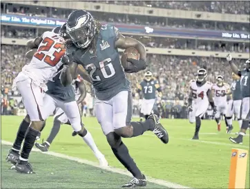  ?? MATT ROURKE — THE ASSOCIATED PRESS ?? Eagles running back Jay Ajayi scores one of his two touchdowns during Thursday’s season-opening win over the Falcons.