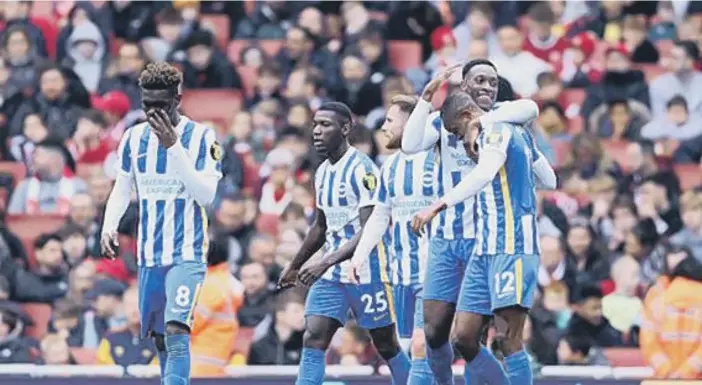  ?? ?? Danny Welbeck congratula­tes Enock Mwepu after his goal against Arsenal