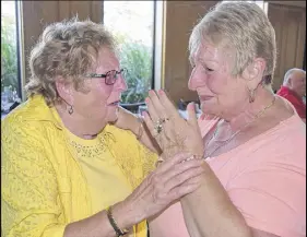  ?? HARRY sULLIVAN/TRURO DAILY NEWs ?? Former RBC employees Edie Leet and Rita MacInnis shared happy tears and hugs as they greeted each other during a 50th anniversar­y reunion of when they worked together in Happy Valley-Goose Bay, N.L., in 1967.
