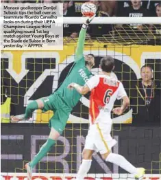  ??  ?? Monaco goalkeeper Danijel Subasic tips the ball over as teammate Ricardo Carvalho looks on during their UEFA Champions League third qualifying round 1st leg match against Young Boys at the Stade de Suisse in Bern yesterday. – AFPPIX