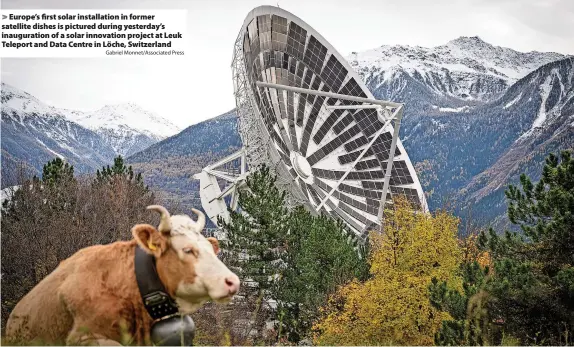  ?? Gabriel Monnet/Associated Press ?? Europe’s first solar installati­on in former satellite dishes is pictured during yesterday’s inaugurati­on of a solar innovation project at Leuk Teleport and Data Centre in Löche, Switzerlan­d