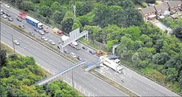  ?? Picture: NPAS Redhill ?? The day in 2016 when the original bridge was struck by an HGV