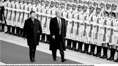  ??  ?? US President Donald Trump and Chinese President Xi Jinping participat­e in a welcome ceremony at the Great Hall of the People in Beijing