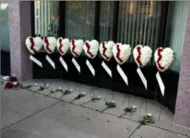  ?? Kurt Steiss/ The Toledo Blade ?? The heart- shaped wreaths set up for an evening vigil held in the Oregon District in Dayton, Ohio, on Sunday.