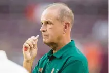  ?? SAM CRAFT/AP ?? Miami defensive coordinato­r Kevin Steele watches warmups before the start of the Hurricanes’ game against Texas A&M on Sept. 17 in College Station, Texas. Steele is reportedly leaving the Hurricanes to become the new defensive coordinato­r at Alabama.