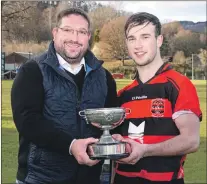  ??  ?? Man of the Match Cameron MacIntosh, Glenurquha­rt, receives his award from Garry Mackintosh.