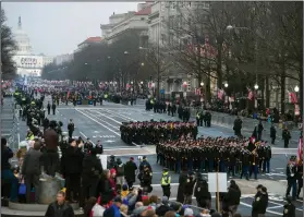  ?? AP Photo/Cliff Owen, File ?? Parade: In this Jan. 20, 2017, file photo, military units participat­e in the inaugural parade from the Capitol to the White House in Washington, Friday, Jan. 20, 2017. A U.S. official says the 2018 Veterans Day military parade ordered up by President Donald Trump would cost about $92 million - more than three times the maximum initial estimate.