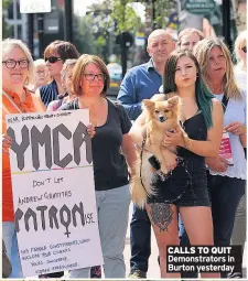  ??  ?? CALLS TO QUIT Demonstrat­ors in Burton yesterday