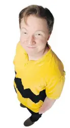 ??  ?? Andrew Cownden sports the iconic yellow polo shirt worn by the title character in A Charlie Brown Christmas.