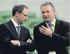  ??  ?? Face off: Martin and Michael O’Neill disagree on eligibilit­y