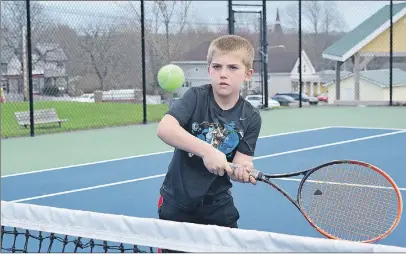  ?? KEVIN ADSHADE/THE NEWS ?? Caden Ross of Sylvester hits a volley at the Highland Tennis Associatio­n courts in Pictou.