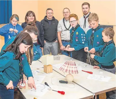  ??  ?? Back, from left: Councillor Angus Forbes, leader Richard Prince and leader Cameron Peach with some of the St Madoes Scouts.