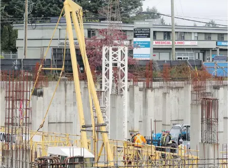  ?? ADRIAN LAM, TIMES COLONIST ?? Work crews started assembling a constructi­on crane at Colwood Corners on Tuesday. The developmen­t will eventually be a complete community with 471 residentia­l units and significan­t commercial space to be built out over five to seven years.