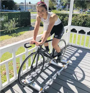  ?? PHOTOS: MARISA TWENTYMAN/DIANNE MANSON ?? Making the most of it . . . Top New Zealand track cyclist Natasha Hansen trains on rollers on the front porch at home during her time in lockdown. Above right: High performanc­e physiother­apist Rone Thompson helps Hansen off the track after she was concussed in a crash during last year’s track nationals.