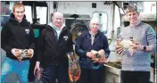  ??  ?? Alistair Dutton chats with crew on board the White Heather fishing boat.