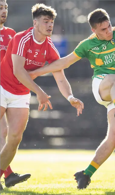  ??  ?? Louth’s Derek Maguire gets a block in on Damian Moran during Saturday’s Qualifier. Pictures: Ramsey Cardy /SPORTSFI