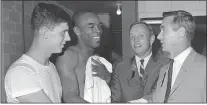  ?? THE ASSOCIATED PRESS FILE ?? Purdue college football players Mike Phipps, left, and Leroy Keyes, second from left, are congratula­ted by Purdue alumni astronauts Neil Armstrong, second from right, and Eugene Cernan, right, following Purdue’s victory over Texas A&M in Dallas on Sept. 24, 1967. Keyes, a two-time AllAmerica­n and one of the greatest players in school history, and an Eagle for four years, has died at 74.