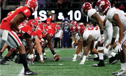  ?? Photograph: Kevin C Cox/Getty Images ?? College football is moving forward as scheduled amid the coronaviru­s pandemic, but with far more questions than answers.
