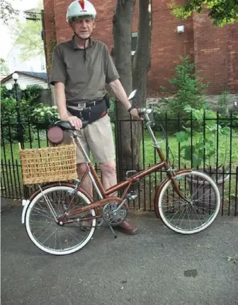  ??  ?? Chris Bradshaw of Sandy Hill in Ottawa with his 1978 Raleigh Twenty folding bike that he purchased on Kijiji.