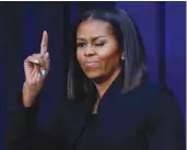  ?? — AP ?? WASHINGTON: First lady Michelle Obama ‘winks’ and gestures to guests after speaking following the screening for the movie ‘Hidden Figures,’ Thursday, Dec 15, 2016, in the South Court Auditorium in the Eisenhower Executive Office Building on the White...